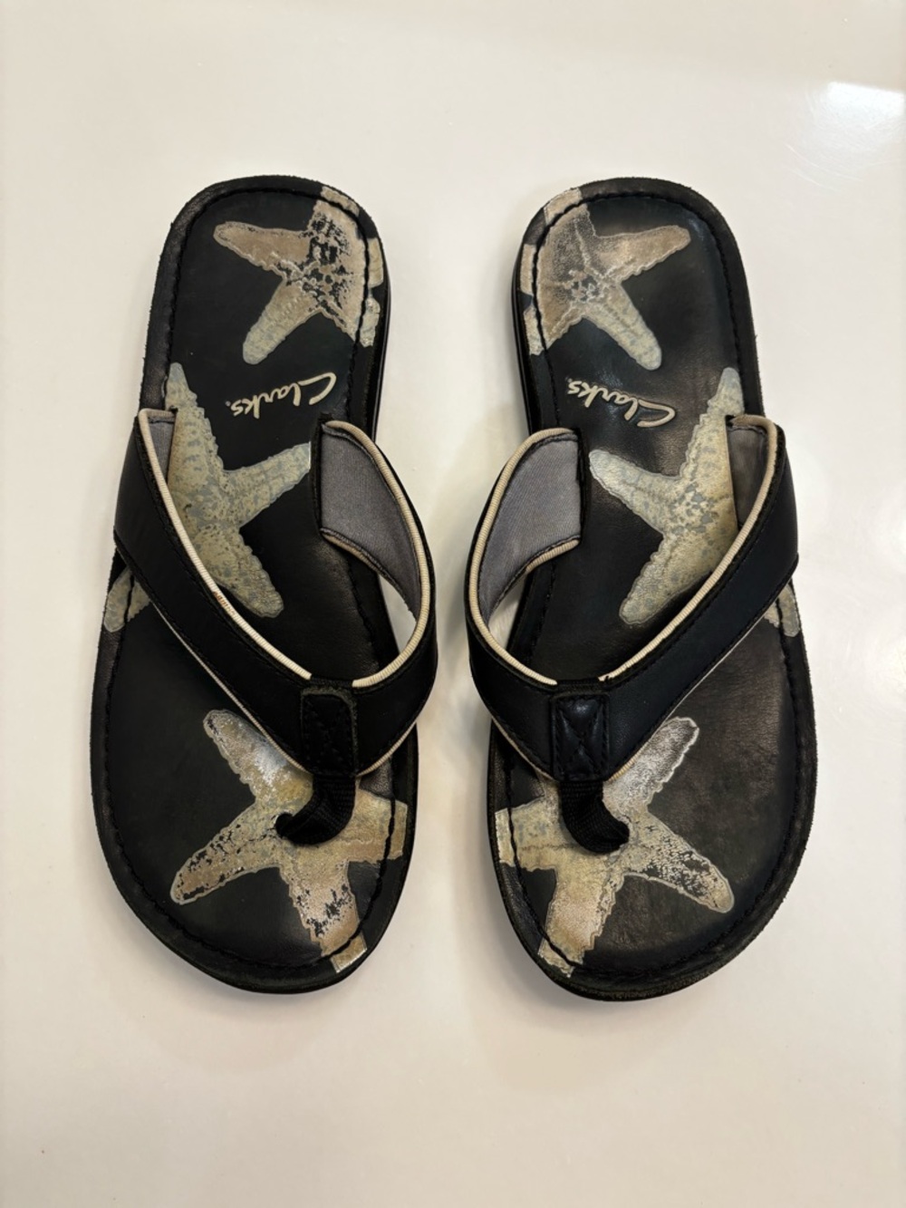 Clarks Black and Beige Starfish Print Flip Flop Sandals